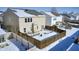 Aerial view of a house with a fenced backyard in the snow at 2959 Hearthside Dr, Greenwood, IN 46143