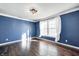 Bright bedroom with hardwood floors and a large window at 2959 Hearthside Dr, Greenwood, IN 46143