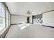 Bright bedroom with grey and white walls, carpet, and a ceiling fan at 2959 Hearthside Dr, Greenwood, IN 46143