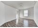 Simple bedroom with hardwood floors and a window at 2959 Hearthside Dr, Greenwood, IN 46143