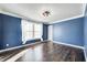 Bright bedroom with hardwood floors and a large window at 2959 Hearthside Dr, Greenwood, IN 46143