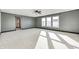 Large bedroom with grey walls, grey carpet, and plenty of natural light at 2959 Hearthside Dr, Greenwood, IN 46143
