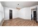 Bright dining room with hardwood floors and a unique chandelier at 2959 Hearthside Dr, Greenwood, IN 46143