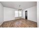 Spacious dining room with hardwood floors and a unique chandelier at 2959 Hearthside Dr, Greenwood, IN 46143