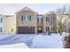 Brick two-story house with a brown garage door and snow-covered yard at 2959 Hearthside Dr, Greenwood, IN 46143