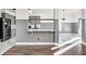 Modern kitchen with gray cabinets, marble countertops, and stainless steel appliances at 2959 Hearthside Dr, Greenwood, IN 46143