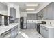 Modern kitchen with gray cabinets and marble countertops at 2959 Hearthside Dr, Greenwood, IN 46143
