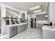 Modern kitchen with gray cabinets, marble countertops, and stainless steel appliances at 2959 Hearthside Dr, Greenwood, IN 46143