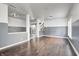 Living room with hardwood floors, gray walls, and a barn door at 2959 Hearthside Dr, Greenwood, IN 46143