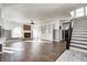 Spacious living area with hardwood floors, fireplace, and built-in shelving at 2959 Hearthside Dr, Greenwood, IN 46143