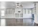 Spacious living area with dark hardwood floors and built-in white cabinets at 2959 Hearthside Dr, Greenwood, IN 46143