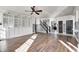 Bright living room with hardwood floors, built-in shelving, and a staircase at 2959 Hearthside Dr, Greenwood, IN 46143
