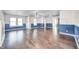 Spacious living room with hardwood floors, built-in shelving, and blue accent walls at 2959 Hearthside Dr, Greenwood, IN 46143