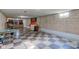 Unfinished basement with checkerboard floor and exercise equipment at 4522 Thornleigh Dr, Indianapolis, IN 46226