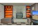 Brick fireplace with built-in shelves in basement at 4522 Thornleigh Dr, Indianapolis, IN 46226
