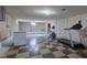 Unfinished basement with exercise equipment and checkerboard floor at 4522 Thornleigh Dr, Indianapolis, IN 46226