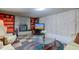 Finished basement Gathering room with fireplace and seating at 4522 Thornleigh Dr, Indianapolis, IN 46226