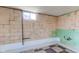 Unfinished basement with block walls and a small window at 4522 Thornleigh Dr, Indianapolis, IN 46226