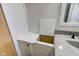 Subtle bathroom built-in storage with white cabinet and drawers at 4522 Thornleigh Dr, Indianapolis, IN 46226
