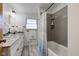Updated bathroom with double vanity, walk-in shower, and grey walls at 4522 Thornleigh Dr, Indianapolis, IN 46226