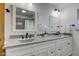 Bathroom with double vanity, granite countertop, and white cabinets at 4522 Thornleigh Dr, Indianapolis, IN 46226