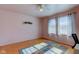 Bright bedroom with hardwood floors, ceiling fan, and ample natural light at 4522 Thornleigh Dr, Indianapolis, IN 46226