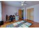 Bedroom with wood floors, double closets, and a view of the hallway at 4522 Thornleigh Dr, Indianapolis, IN 46226