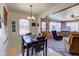 Charming dining area with a dark wood table and chairs, adjacent to the living room at 4522 Thornleigh Dr, Indianapolis, IN 46226