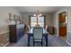 Elegant dining room with wood table and large windows at 4522 Thornleigh Dr, Indianapolis, IN 46226