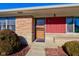 Inviting front entrance with a wooden door and landscaping at 4522 Thornleigh Dr, Indianapolis, IN 46226