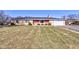 Brick ranch home with attached garage and a spacious lawn at 4522 Thornleigh Dr, Indianapolis, IN 46226