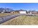 Brick ranch home with a long driveway and mature landscaping at 4522 Thornleigh Dr, Indianapolis, IN 46226