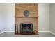 Brick fireplace with decorative mantle and hearth at 4522 Thornleigh Dr, Indianapolis, IN 46226