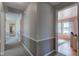 Bright hallway with neutral walls and carpet flooring at 4522 Thornleigh Dr, Indianapolis, IN 46226