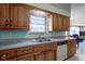 Kitchen with wood cabinets and stainless steel sink at 4522 Thornleigh Dr, Indianapolis, IN 46226