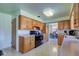 Spacious kitchen boasting wood cabinets, black appliances, and an open layout at 4522 Thornleigh Dr, Indianapolis, IN 46226
