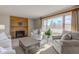 Spacious living room with large windows and fireplace at 4522 Thornleigh Dr, Indianapolis, IN 46226