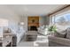 Bright living room features a cozy fireplace and large windows at 4522 Thornleigh Dr, Indianapolis, IN 46226