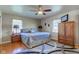 Large main bedroom with a king-size bed and wood dresser at 4522 Thornleigh Dr, Indianapolis, IN 46226