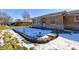 Small patio area with snow and landscape lighting at 4522 Thornleigh Dr, Indianapolis, IN 46226