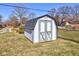 White shed with gray roof in grassy yard at 4522 Thornleigh Dr, Indianapolis, IN 46226
