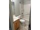 Bathroom includes a sink, toilet, and shower with white tile at 6442 E Flat Rock Dr, Camby, IN 46113