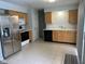 Functional kitchen with stainless steel refrigerator and updated appliances, providing a practical space for cooking at 6442 E Flat Rock Dr, Camby, IN 46113