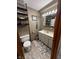 Cozy bathroom with a decorative shelves, stylish vanity, and attractive tile flooring at 797 S Graveyard Rd, Paragon, IN 46166