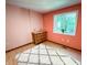 Bright bedroom featuring a wooden dresser, plush rug, and a large window for ample natural light at 797 S Graveyard Rd, Paragon, IN 46166