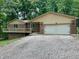 Charming brick home featuring an attached two-car garage and a partially covered front porch at 797 S Graveyard Rd, Paragon, IN 46166