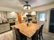 Open kitchen featuring an eat-in island, stainless appliances, butcher block counters and stylish lighting at 797 S Graveyard Rd, Paragon, IN 46166
