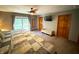 Large main bedroom boasting an attached balcony, ceiling fan, and wood accents at 797 S Graveyard Rd, Paragon, IN 46166