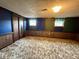Finished basement with paneled walls, carpet flooring, and natural light at 801 Spring Valley Dr, Indianapolis, IN 46231
