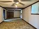 Spacious basement with a fireplace and ceiling fans at 801 Spring Valley Dr, Indianapolis, IN 46231